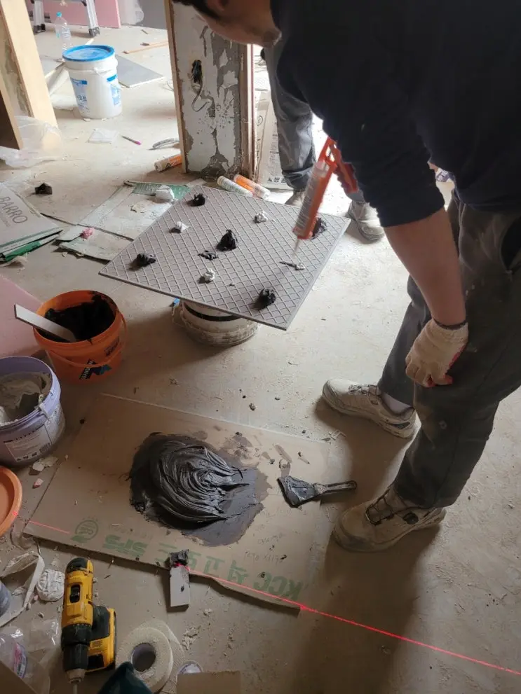 Both Bathrooms Tiled — and Epoxy for the Heavy Ones — photo 8