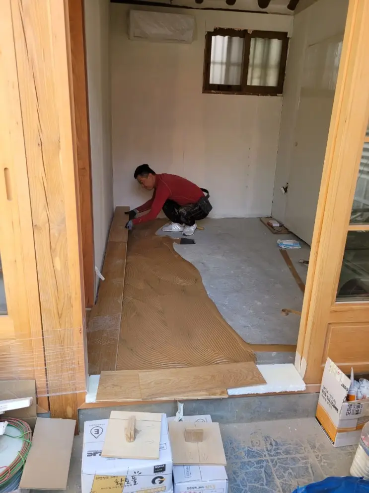 Hardwood Over Red Clay Paste: The Floor Goes In — photo 3